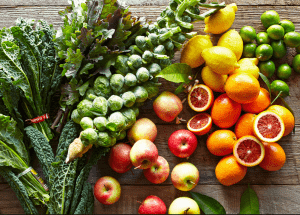 a group of fruits and vegetables on a wood surface Healthy Weight Loss Diets Brighton